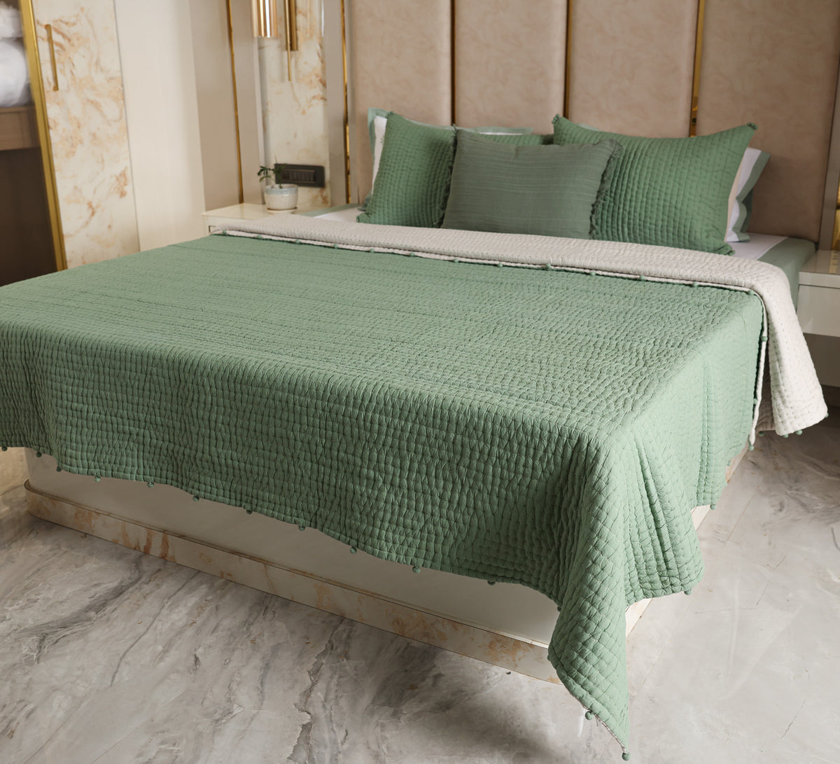 Hand quilted reversable double bed quilt with pompom