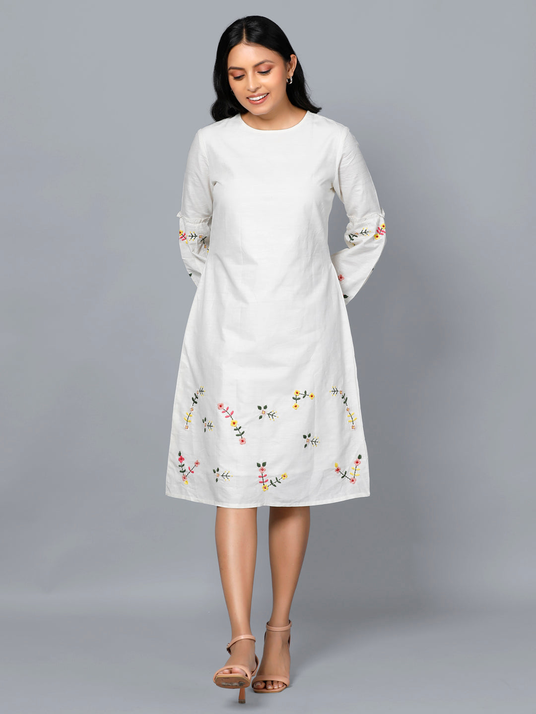 khadi silk dress Khadi spun silk embroidered dress in ivory color.Vibrant floral placement embroidery at sleeves and dress hem.Bishop Sleeves with back zipper opening.Self tone soft cotton lining for comfort and ease. Length:- 41 inches